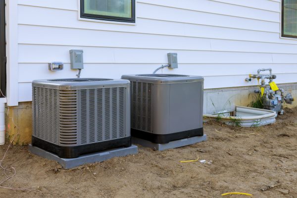 Air conditioning system unit installed outside facade of the new house Loughman FL