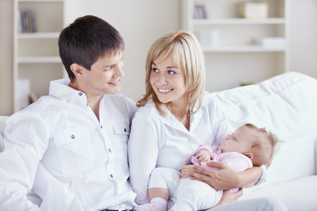 Young parents with babies at home